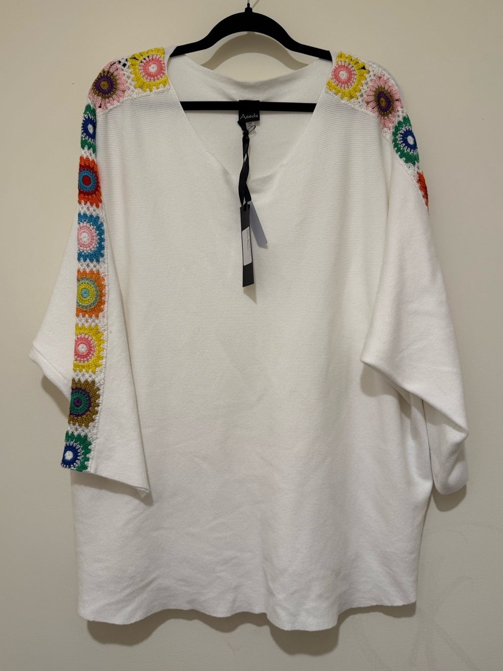 Aveda White V‑Neck Sweater with Multicolor Crochet Shoulder Detail
